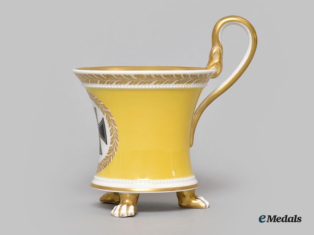 germany,_imperial._a_yellow_glazed_kpm_clawfoot_cup_with_iron_cross_motif_l22_mnc9388_610