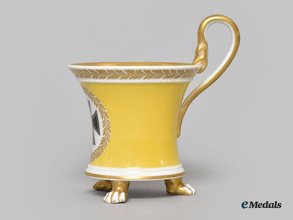 germany,_imperial._a_yellow_glazed_kpm_clawfoot_cup_with_iron_cross_motif_l22_mnc9388_610