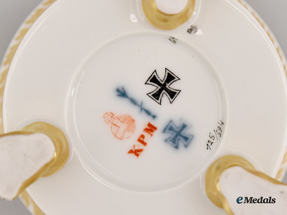 germany,_imperial._a_yellow_glazed_kpm_clawfoot_cup_with_iron_cross_motif_l22_mnc9392_608