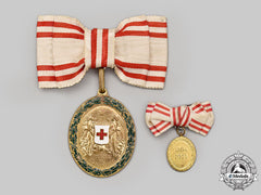 Austria, Empire. An Honour Decoration Of The Red Cross, Bronze Grade Medal With War Decoration For Ladies, Fullsize And Miniature