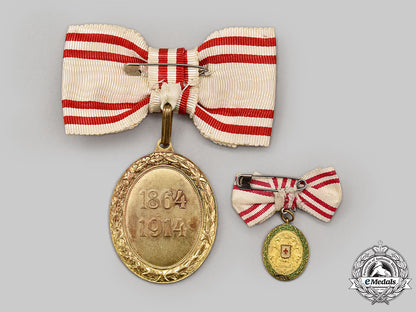 austria,_empire._an_honour_decoration_of_the_red_cross,_bronze_grade_medal_with_war_decoration_for_ladies,_fullsize_and_miniature_l22_mnc9752_832
