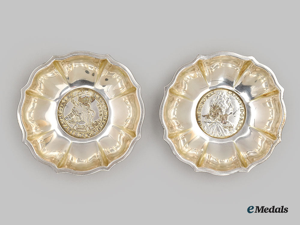 austria,_empire._two_silver_dishes_embedded_with_coins_of_holy_roman_emperor_charles_vi&_archduke_leopold_v._l22_mnc9829_646_1