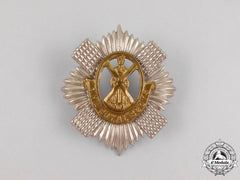 A British Royal Scots Cap Badge