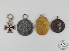 A Grouping Of Four First And Second War German Medals And Awards