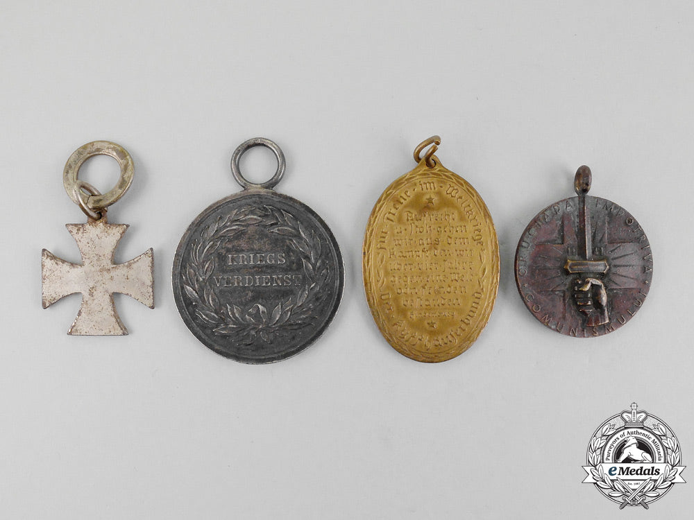 a_grouping_of_four_first_and_second_war_german_medals_and_awards_l_933_1