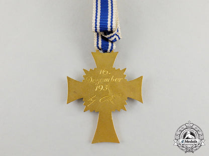 a_cased_gold_grade_mother’s_cross_with_instructions_for_wear_m17-000073
