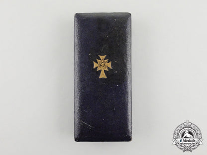 a_cased_gold_grade_mother’s_cross_with_instructions_for_wear_m17-000076