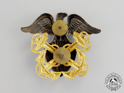 united_states._a(_usn)_officer's_cap_badge,_c.1942_m17-2169