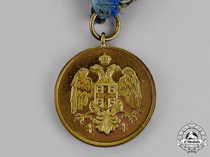 serbia,_kingdom._a_medal_for_zeal,_gold_grade,_type_ii_with_a_single_crown_between_the_eagles'_heads_m18-1511
