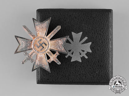 germany,_wehrmacht._a_mint_cased_war_merit_cross_first_class_with_swords,_by_deschler&_sohn_m181_2501