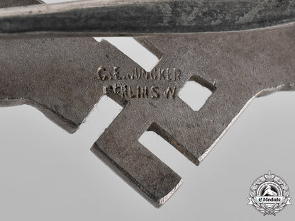 germany,_luftwaffe._a_cased_civilian_radio_operator_badge,_by_c.e._juncker_m181_2519