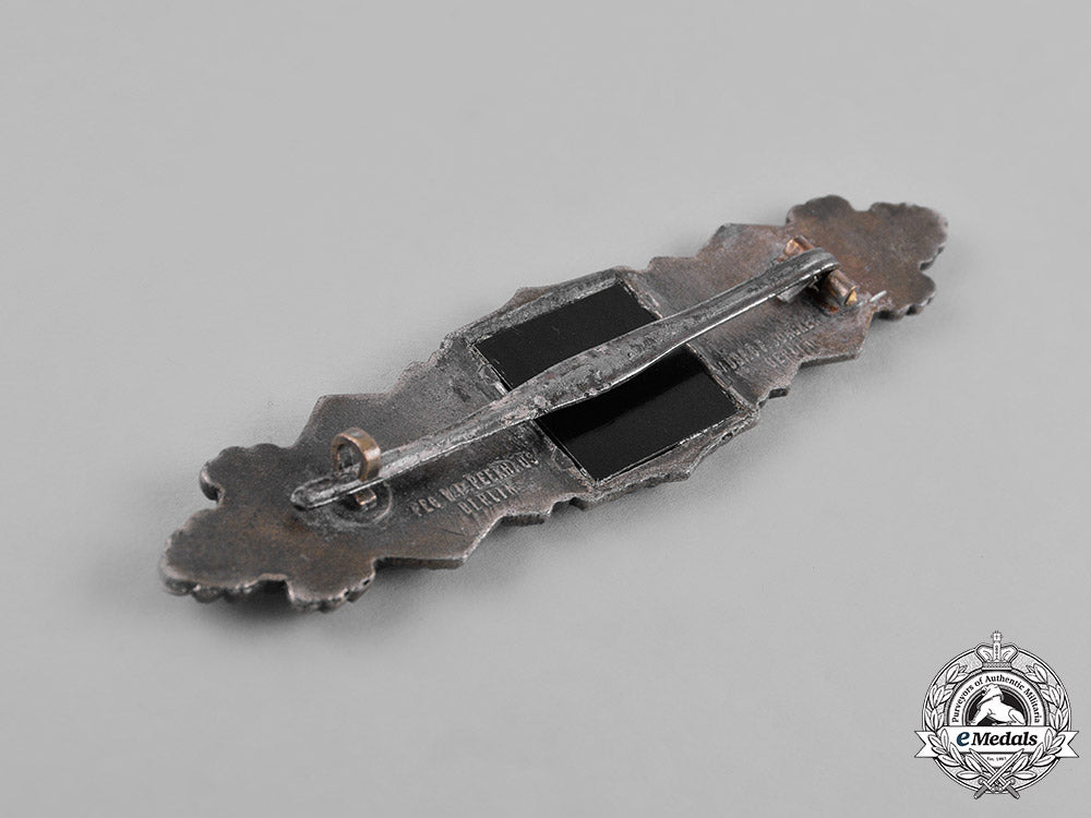 germany,_wehrmacht._a_wehrmacht_close_combat_clasp,_silver_grade,_by_c._e._juncker,_type1.13.1_m181_2542