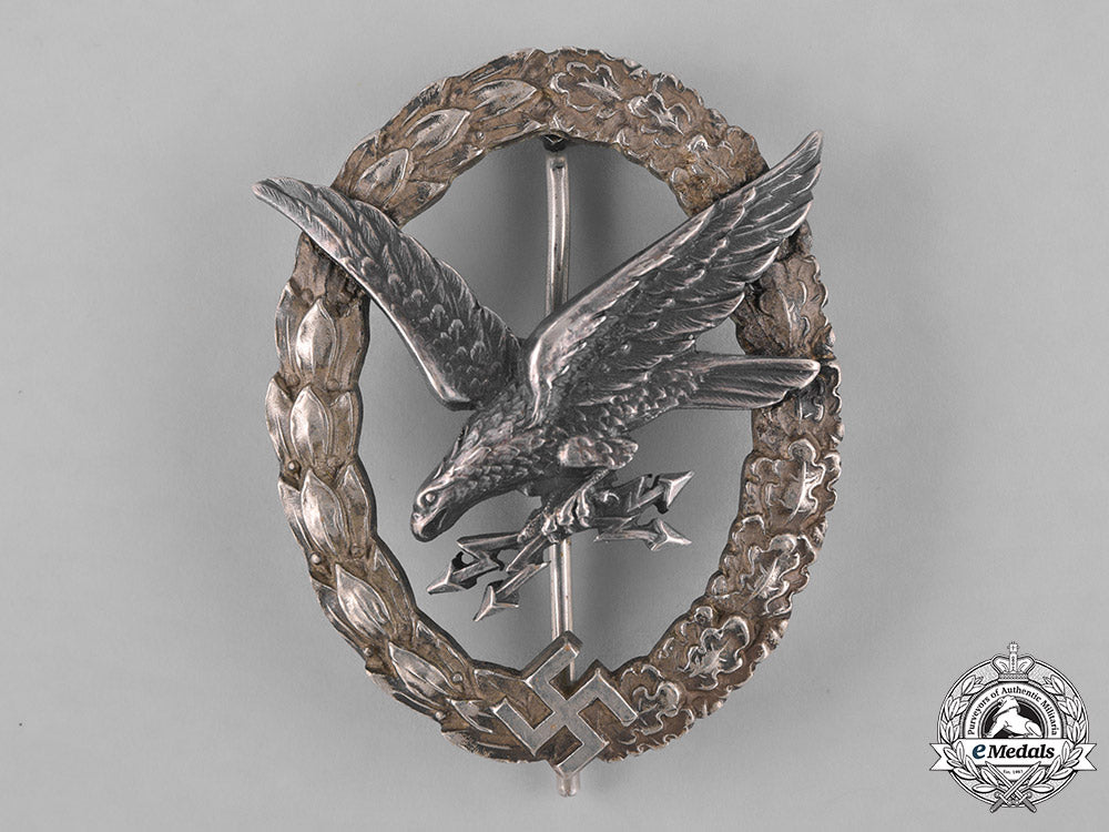 germany,_luftwaffe._a_cased_radio_operator_badge,"_thin_wreath",_by_c.e._juncker,_c.1937_m181_4164