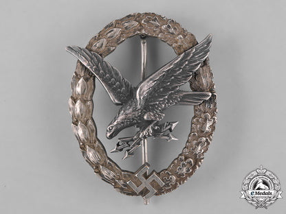 germany,_luftwaffe._a_cased_radio_operator_badge,"_thin_wreath",_by_c.e._juncker,_c.1937_m181_4164