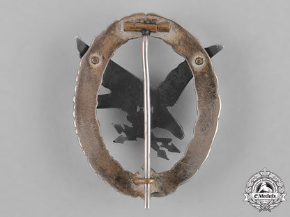 germany,_luftwaffe._a_cased_radio_operator_badge,"_thin_wreath",_by_c.e._juncker,_c.1937_m181_4165