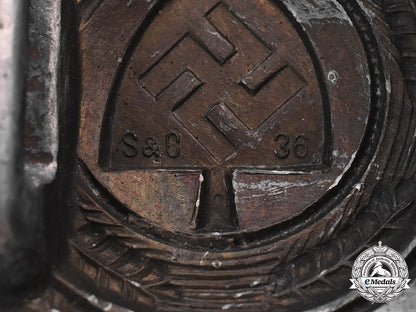 germany,_rad._a_standard_issue_em/_nco’s_rad_belt_buckle,_with_leather_tab,_by_schmöle&_co_m181_5514
