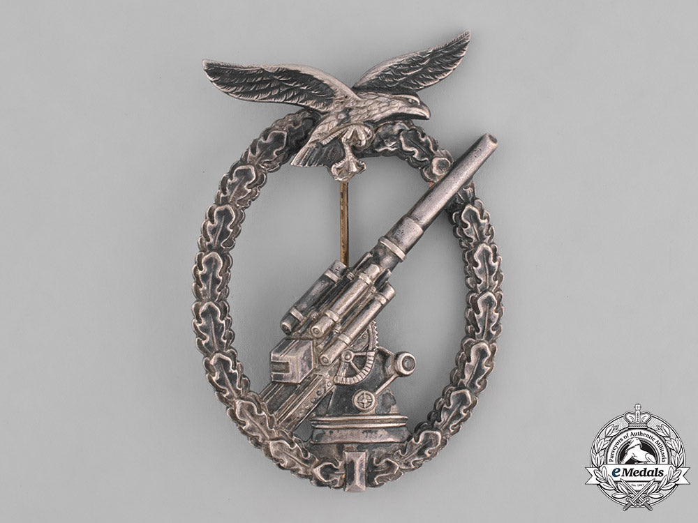 germany,_luftwaffe._a_denazified_luftwaffe_flak_badge_and_presentation_case_belonging_to_unteroffizier_barkau_m181_8159