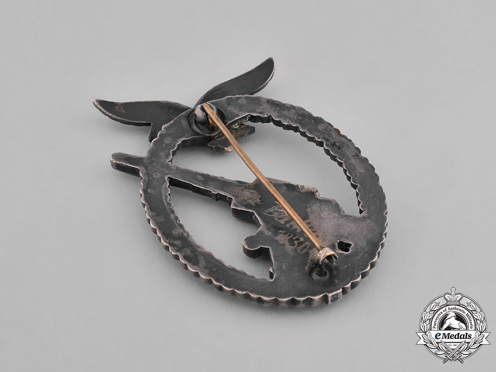germany,_luftwaffe._a_denazified_luftwaffe_flak_badge_and_presentation_case_belonging_to_unteroffizier_barkau_m181_8162