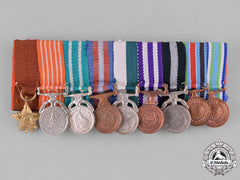 Nepal, Federal Democratic Republic. A Miniature Group Of Nine
