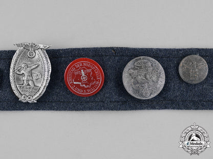 germany,_third_reich._a_souvenir_belt_featuring_day_badges_m182_0428