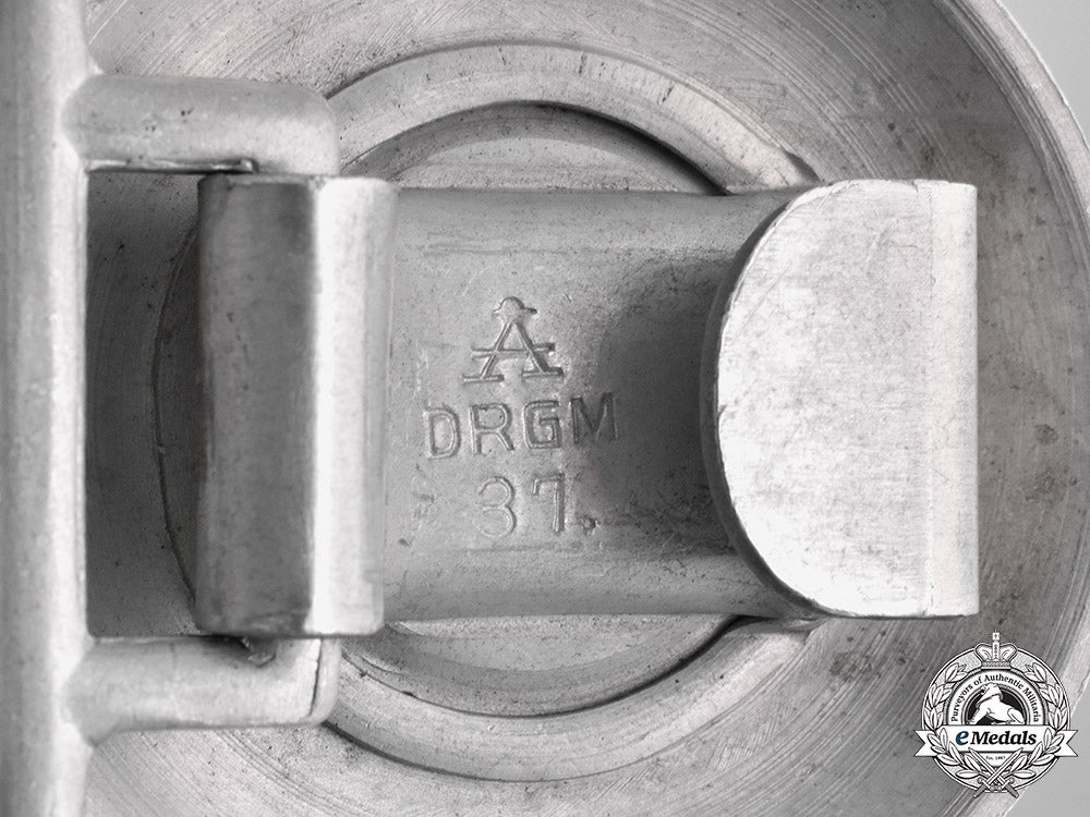 germany,_ordnungspolizei._a_police_officer’s_belt_buckle_by_assmann_with_a2_nd_pattern_ss_brocade_belt_m182_0857