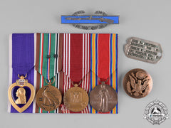 United States. A  Purple Heart Group Of Four, Private John B. Perkins (Canadian), 1944