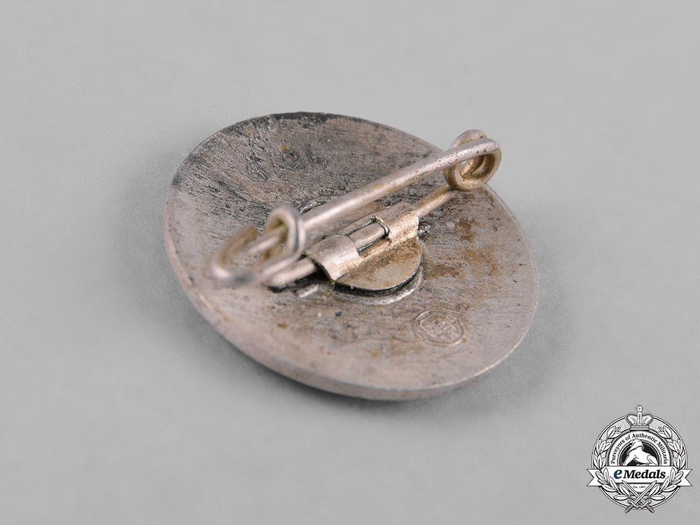 germany,_nsdap._a_membership_badge,_by_rudolf_reiling_m182_1533