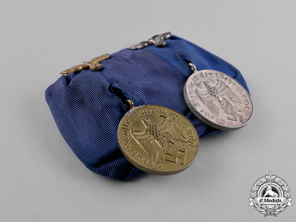 germany,_wehrmacht._a_grouping_of_two_wehrmacht_long_service_medals,_mounted_m18_9695