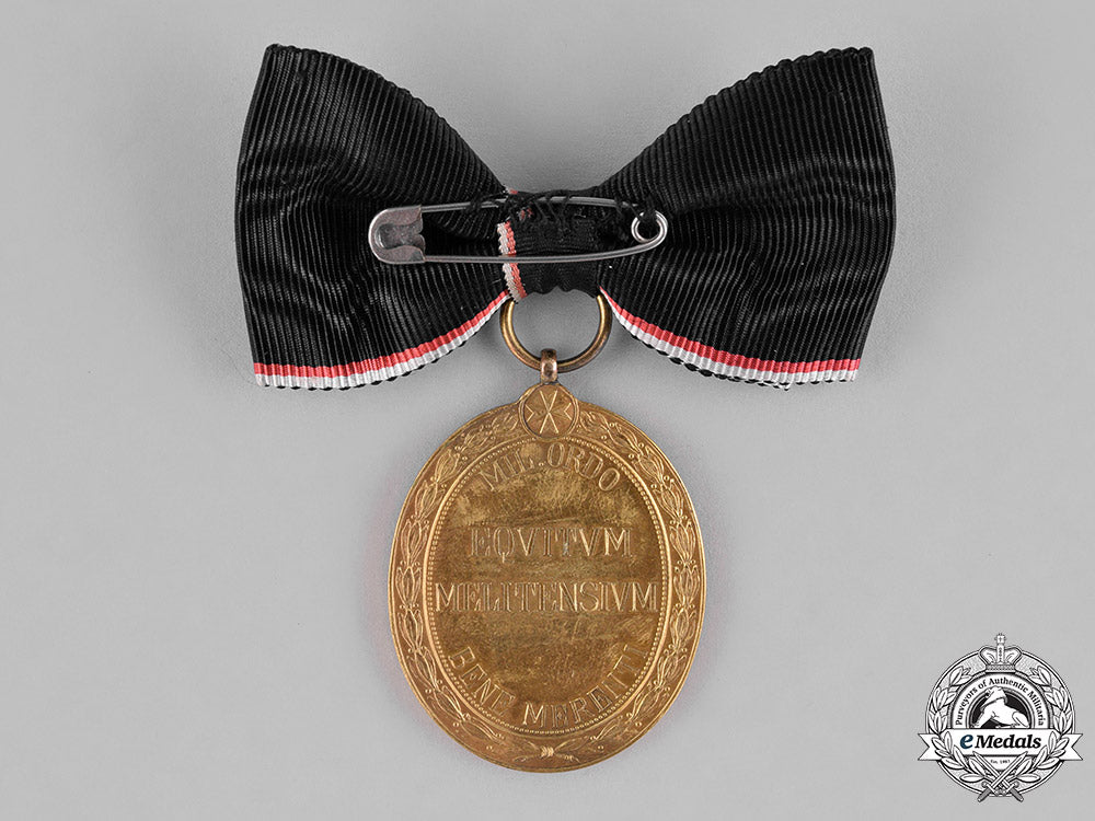 austria,_empire._an_order_of_the_knights_of_malta_gold_merit_medal,_c.1918,_with_wd_ribbon_m18_9888