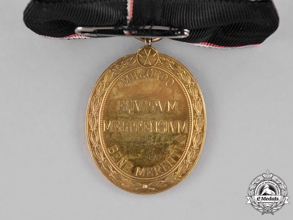 austria,_empire._an_order_of_the_knights_of_malta_gold_merit_medal,_c.1918,_with_wd_ribbon_m18_9890