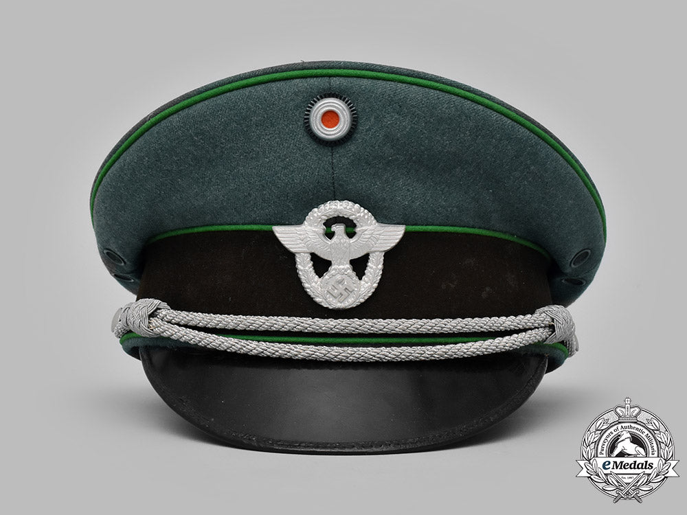 germany,_ordnungspolizei._a_schutzpolizei_officer’s_visor_cap_by_peter_küpper,_c.1939_m19_12982