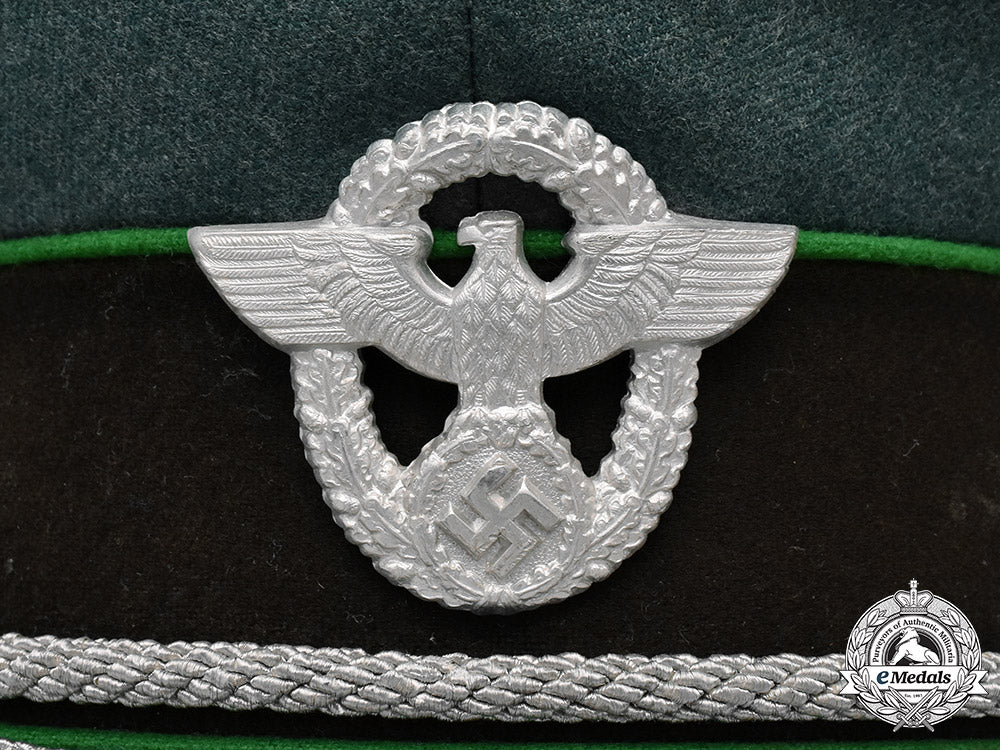 germany,_ordnungspolizei._a_schutzpolizei_officer’s_visor_cap_by_peter_küpper,_c.1939_m19_12986