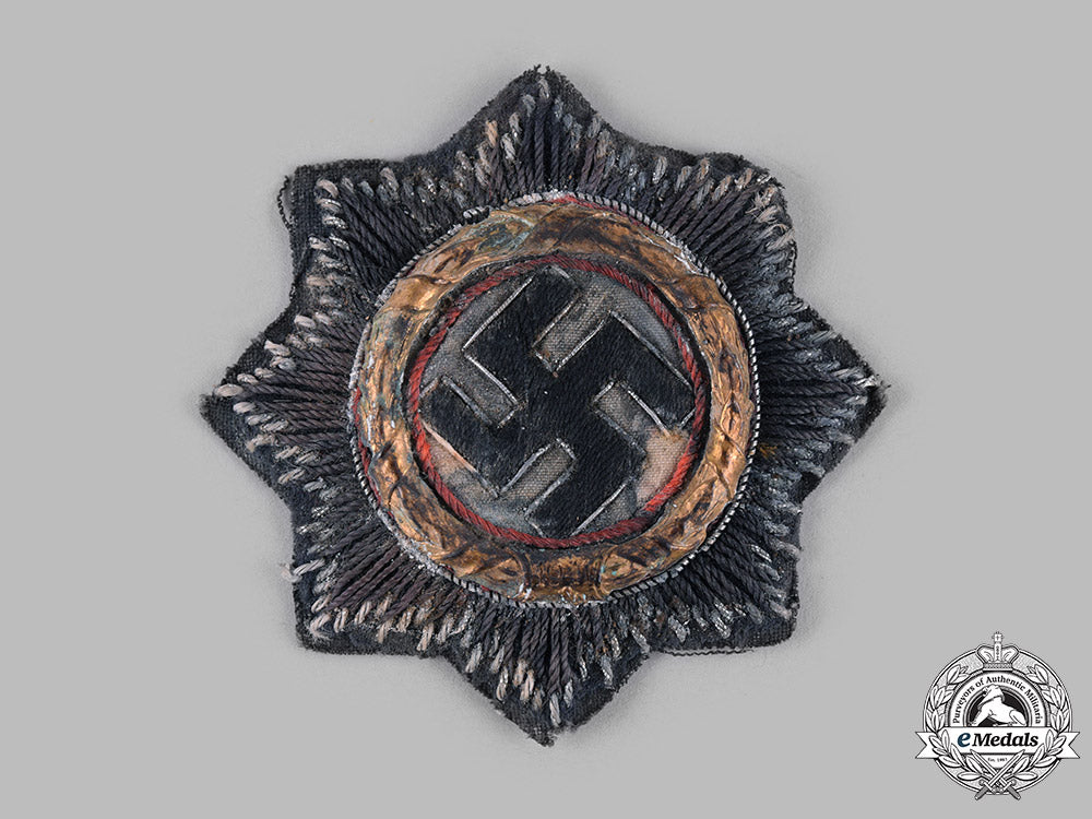 germany,_wehrmacht._a_german_cross_in_gold,_cloth_version,_by_hermann_schmuck&_cie_m19_13710