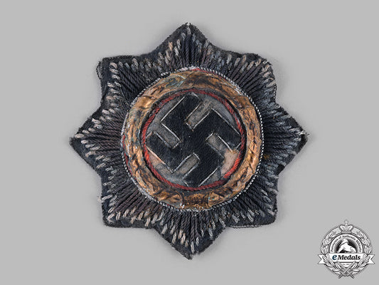 germany,_wehrmacht._a_german_cross_in_gold,_cloth_version,_by_hermann_schmuck&_cie_m19_13710