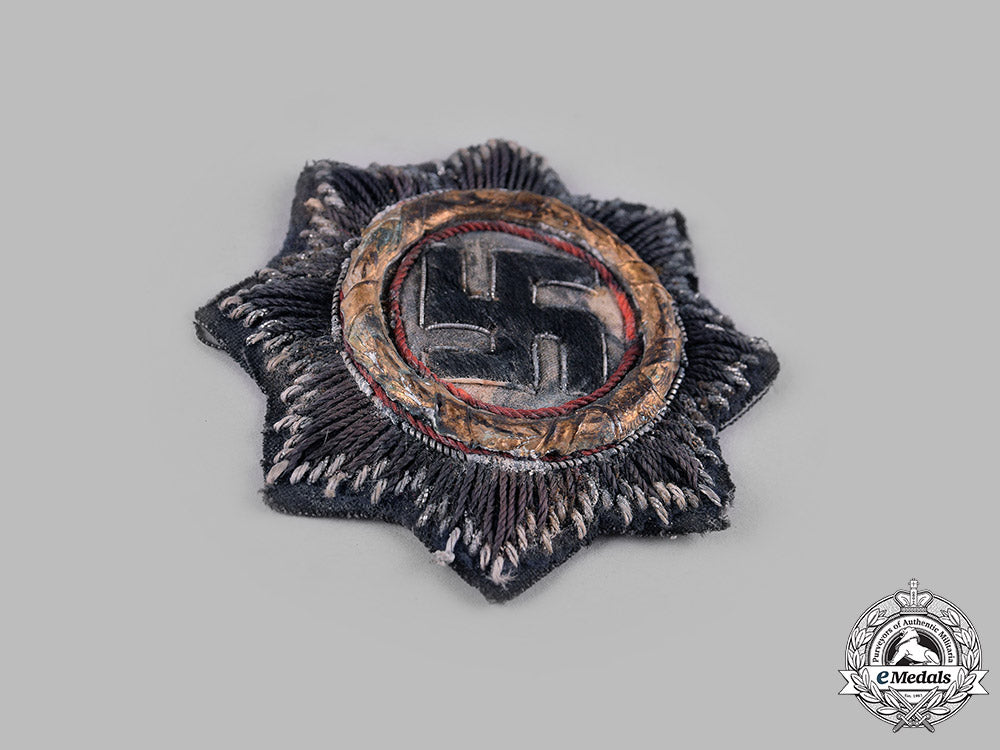 germany,_wehrmacht._a_german_cross_in_gold,_cloth_version,_by_hermann_schmuck&_cie_m19_13712