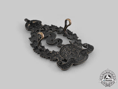 canada,_cef._a2_nd_canadian"_queen's_university"_field_ambulance_cap_badge,_c.1915_m19_17675