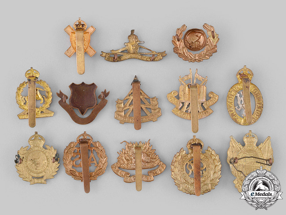 united_kingdom._a_lot_of_thirteen_regimental_badges_m19_20001