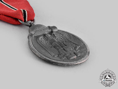 germany,_wehrmacht._an_eastern_front_medal,_with_package_of_issue,_by_carl_poellath_m19_20623