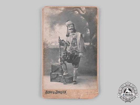 turkey,_ottoman_empire._a_finely_decorated_turkish_soldier's_studio_photograph,_c.1910_m19_22279_2_1