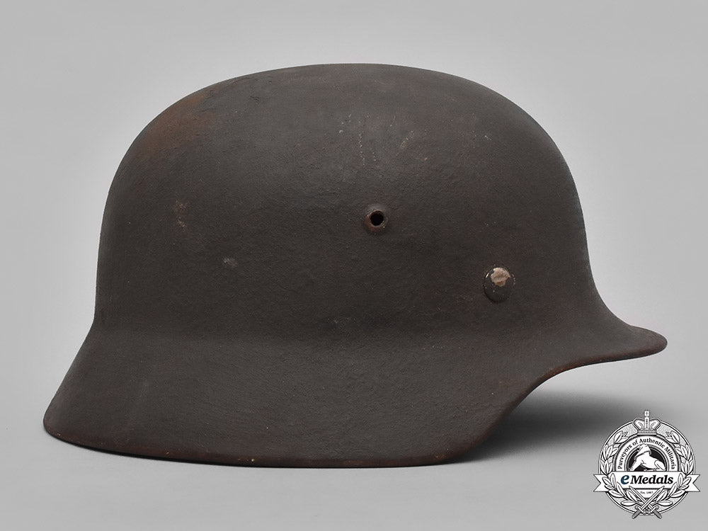 germany,_heer._a_heer_m40_steel_helmet_with_camouflage_cover_m19_3609