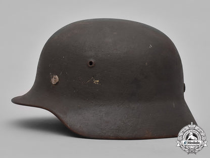 germany,_heer._a_heer_m40_steel_helmet_with_camouflage_cover_m19_3613