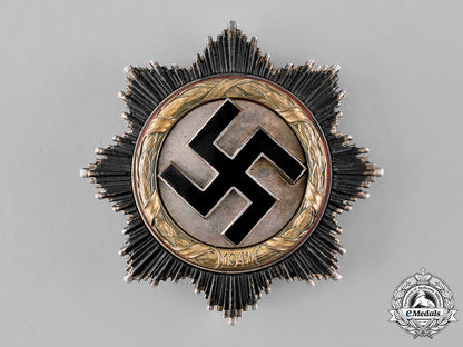 germany,_wehrmacht._a_cased_german_cross_in_gold_by_otto_klein&_co.,_with_personal_effects,_to_erich_jeckstat_m19_8344