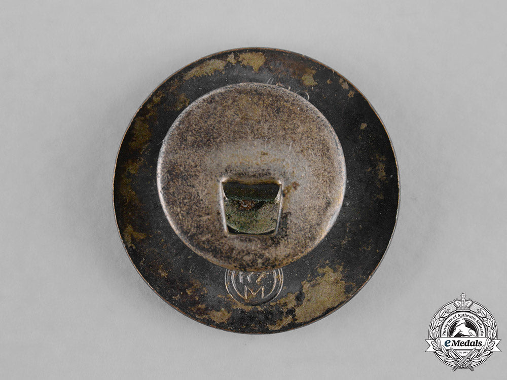 germany,_nsdap._a_party_member’s_buttonhole_badge,_by_fritz_zimmermann_m19_9435