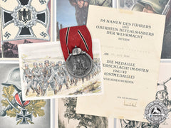 Germany, Wehrmacht. An Eastern Front Medal And Award Document, With Commemorative Postcards