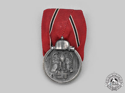 germany,_wehrmacht._an_eastern_front_medal_and_award_document,_with_commemorative_postcards_m20_1300