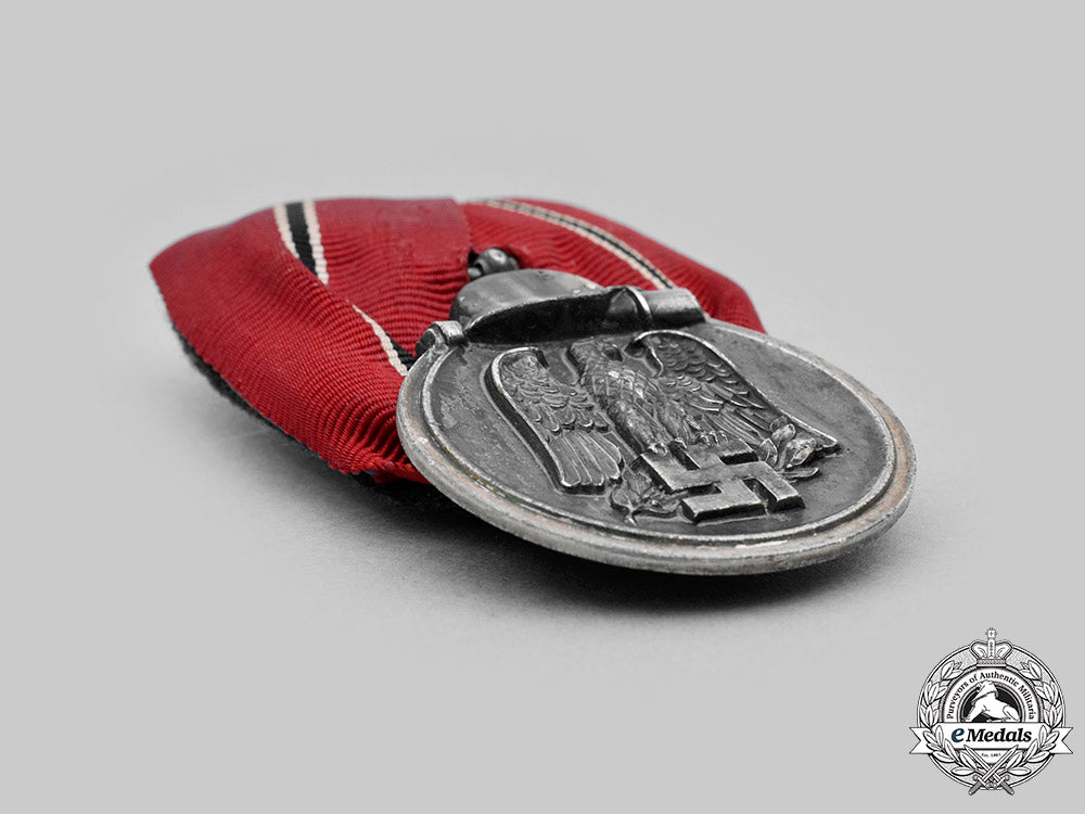 germany,_wehrmacht._an_eastern_front_medal_and_award_document,_with_commemorative_postcards_m20_1303