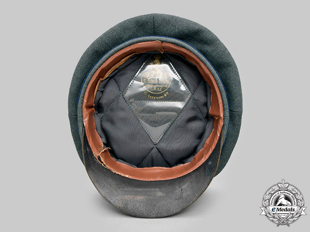 germany,_heer._a_medical_officer’s_visor_cap,_by_n._schega&_neffe_m20_2813_mnc5541_1