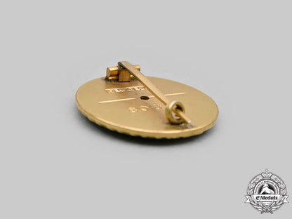 germany,_nsdap._a_golden_party_badge,_large_version,_by_deschler&_sohn_m20_893_mnc1421_1