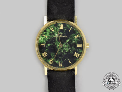 switzerland._a_vintage_yellow_gold_universal_genève_unisex_watch,_c.1970_m21_258_1