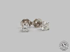 Jewellery. A Pair Of White Gold Round Brilliant Cut Diamond Stud Earrings